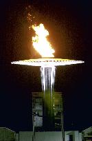 Olympic cauldron burns in Sydney night sky